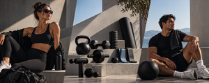 Woman and man beside compact home fitness equipment outdoors